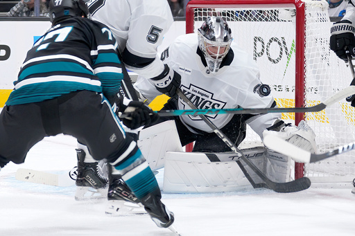Los Angeles Kings goaltender Darcy Kuemper (35) blocks a shot against San Jose Sharks center Michael Misa (77) during the first period of an NHL hockey game in San Jose, Calif., Tuesday, Oct. 28, 2025. (AP Photo/Tony Avelar) Los Angeles Kings goaltender Darcy Kuemper (35) blocks a shot against San Jose Sharks center Michael Misa (77) during the first period of an NHL hockey game in San Jose, Calif., Tuesday, Oct. 28, 2025. (AP Photo/Tony Avelar)