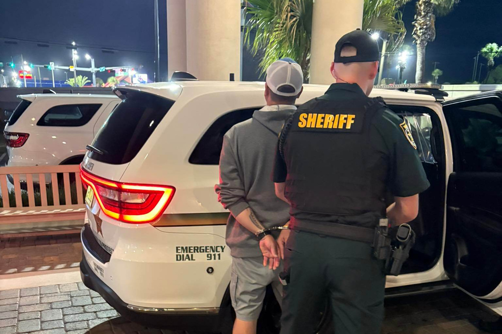 This photo provided by the Okaloosa County Sheriff's Office shows Christopher Gillum being arrested Wednesday, April 22, 2026, at a hotel in Destin, Fla. (Okaloosa County Sheriff's Office via AP)