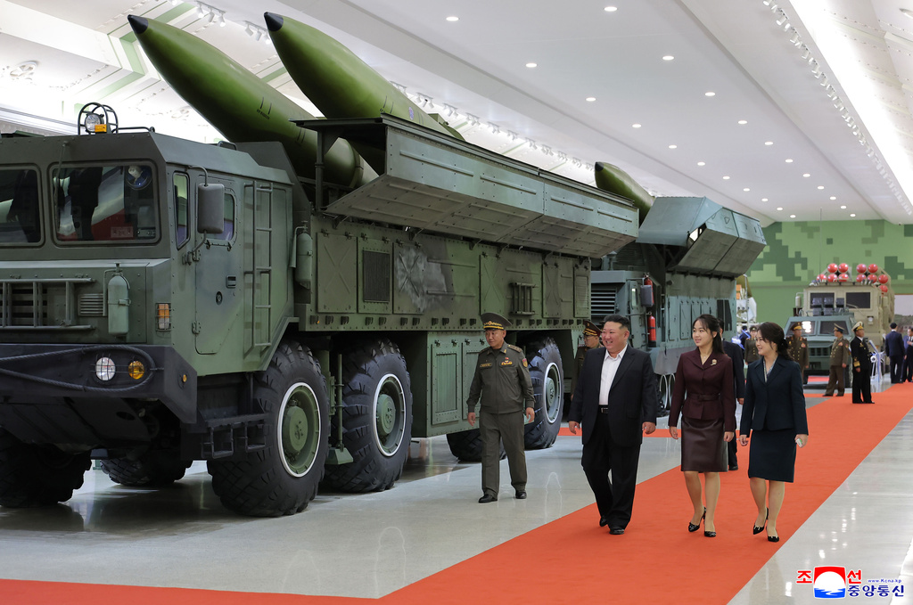 In this photo provided by the North Korean government, its leader Kim Jong Un, front left, his wife and their daughter tour a new defense museum called National Defence Revolution Museum at an undisclosed location in North Korea, Sunday, Oct. 11, 2026. Independent journalists were not given access to cover the event depicted in this image distributed by the North Korean government. The content of this image is as provided and cannot be independently verified. Korean language watermark on image as provided by source reads: "KCNA" which is the abbreviation for Korean Central News Agency. (Korean Central News Agency/Korea News Service via AP)