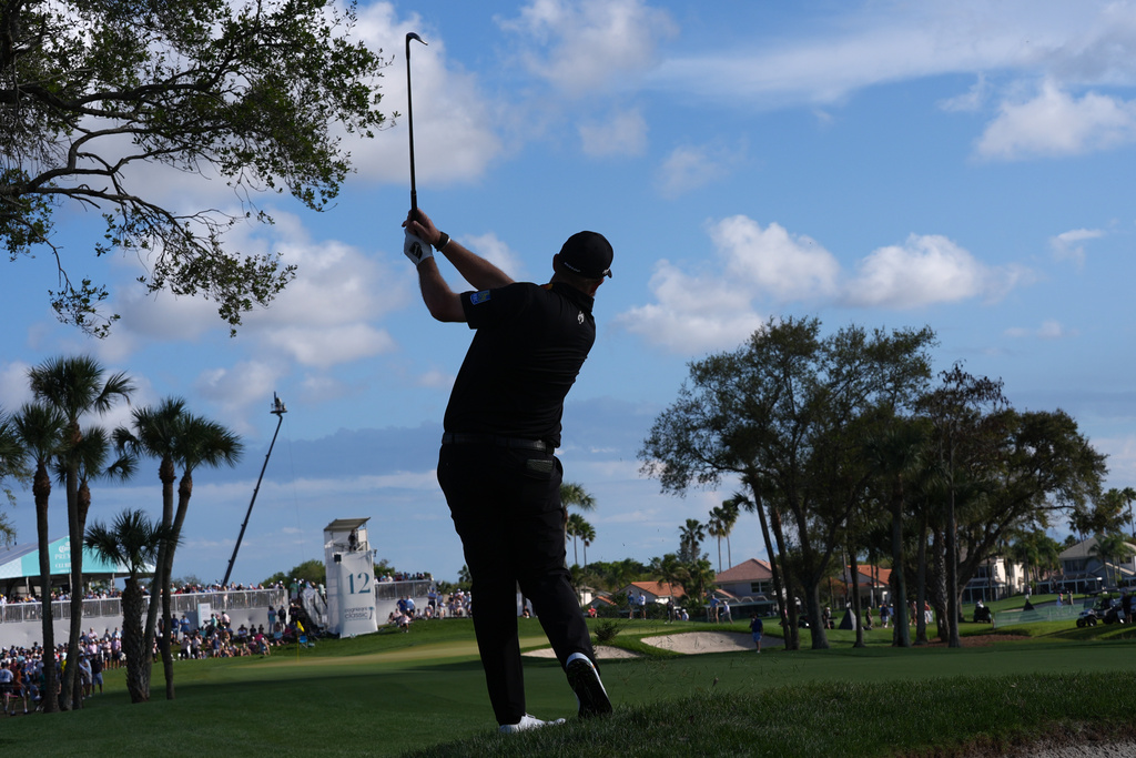 Shane Lowry of Ireland hits from the 12th fairway during the final round of the Cognizant Classic golf tournament, Sunday, March 1, 2026, in Palm Beach Gardens, Fla. (AP Photo/Marta Lavandier)