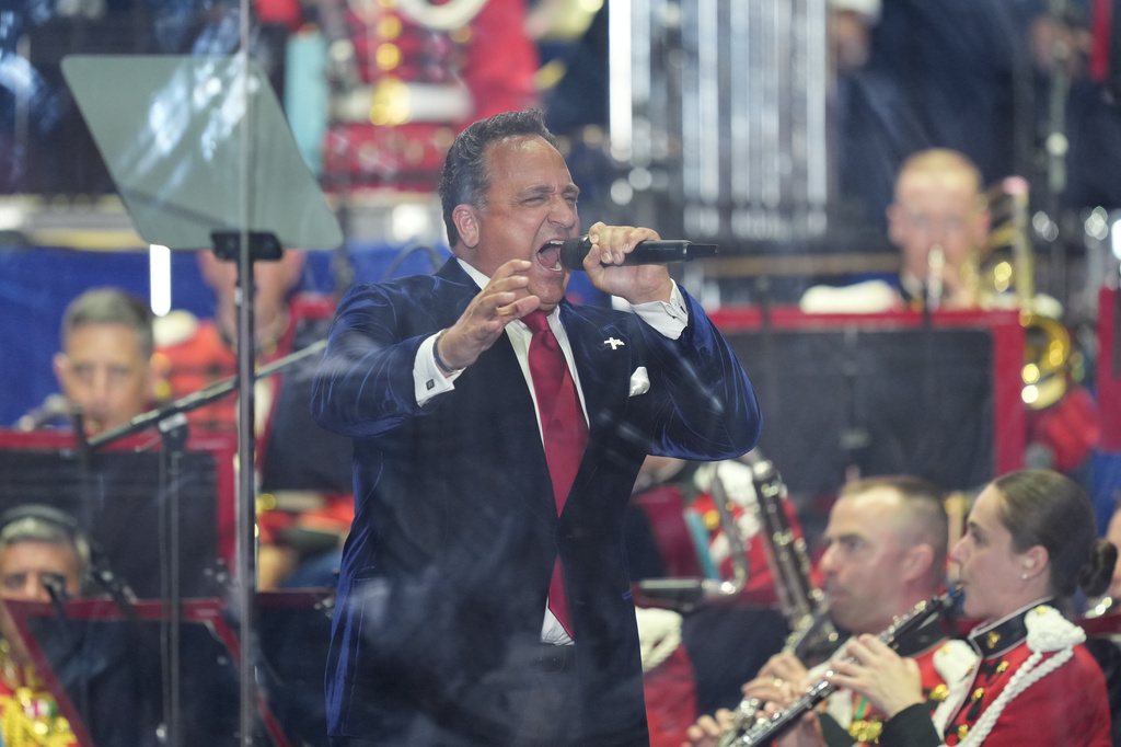 Christopher Maccihio sings before President Donald Trump speaks at the opening of the Great American State Fair on the National Mall, Wednesday, June 24, 2026, in Washington. (AP Photo/Alex Brandon)