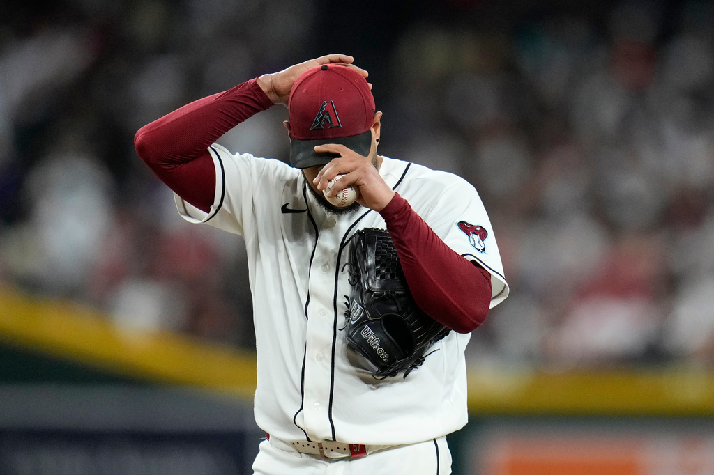 Arizona Diamondbacks starting pitcher Eduardo Rodriguez pauses on the pitcher's mound during the fifth inning of a baseball game against the Philadelphia Phillies, Tuesday, Sept. 1, 2026, in Phoenix. (AP Photo/Ross D. Franklin)