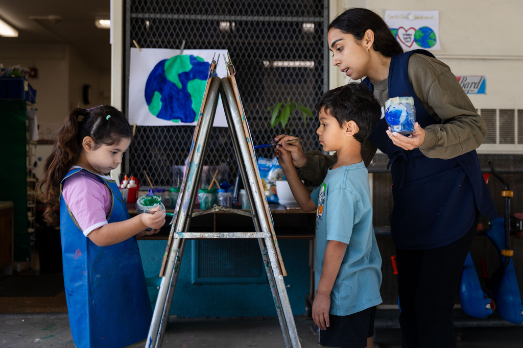 Students paint during a TK class at First Street Elementary School in Los Angeles, on Wednesday, April 22, 2026. (AP Photo/Ethan Swope)