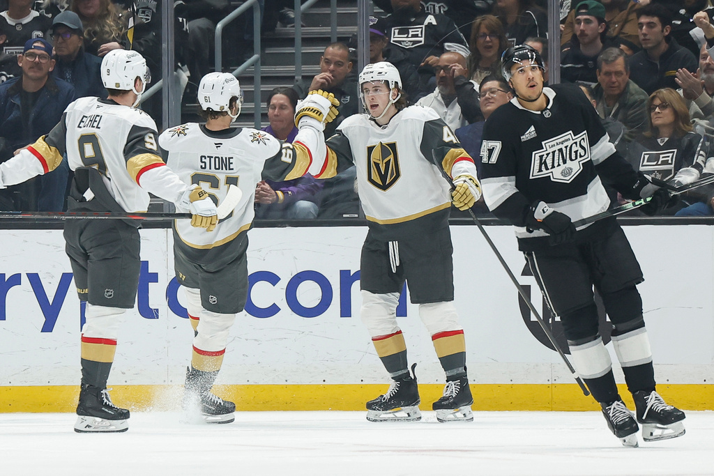 Vegas Golden Knights right wing Braeden Bowman (42) is greeted by Vegas Golden Knights right wing Mark Stone (61) after scoring against the Los Angeles Kings during the second period of an NHL hockey game Wednesday, Jan. 14, 2026, in Los Angeles. (AP Photo/Caroline Brehman)