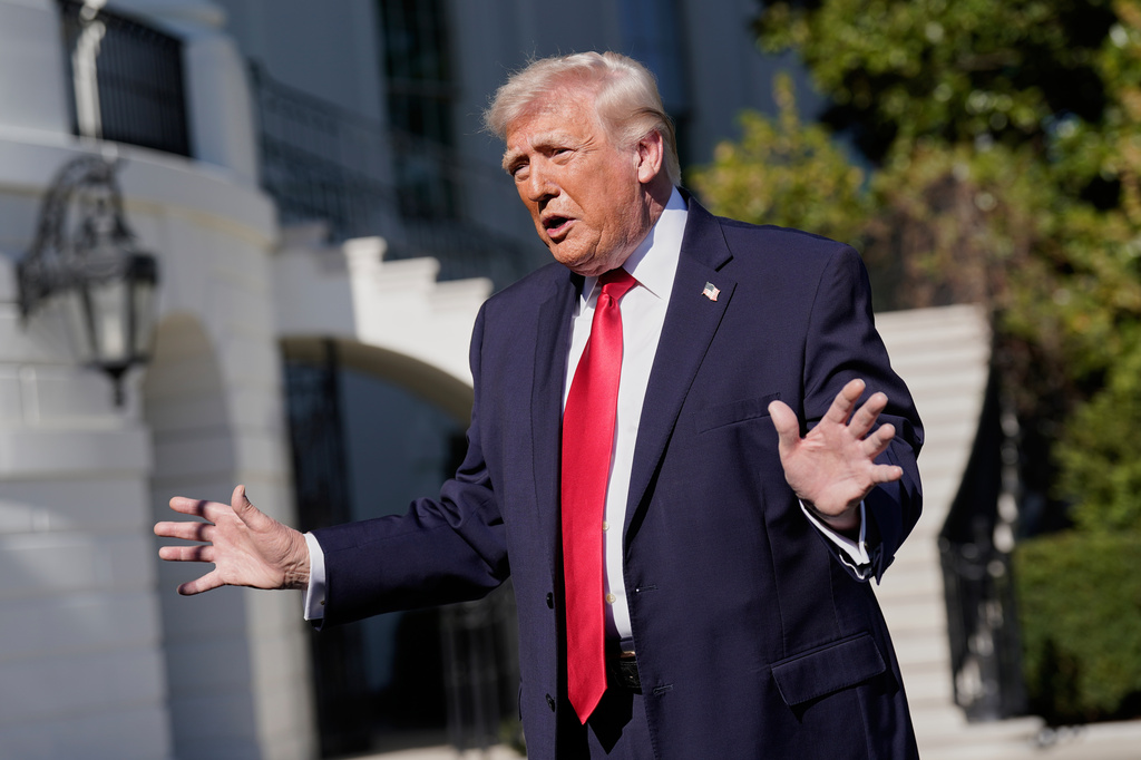 President Donald Trump talks to the media on the South Lawn before departing on Marine One at the White House, Saturday, April 11, 2026, in Washington. (AP Photo/Jose Luis Magana)