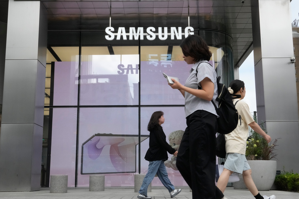People pass by Samsung Gangnam store in Seoul, South Korea, Thursday, July 30, 2026. (AP Photo/Ahn Young-joon)