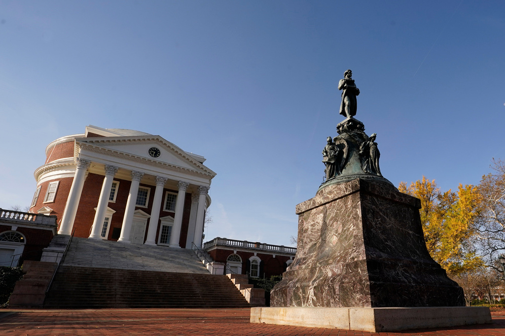 FILE - A statue of University of Virginia founder, Thomas Jefferson, stands watch over the Rotunda at the University of Virginia on Nov. 14, 2022, in Charlottesville. Va. (AP Photo/Steve Helber, File)