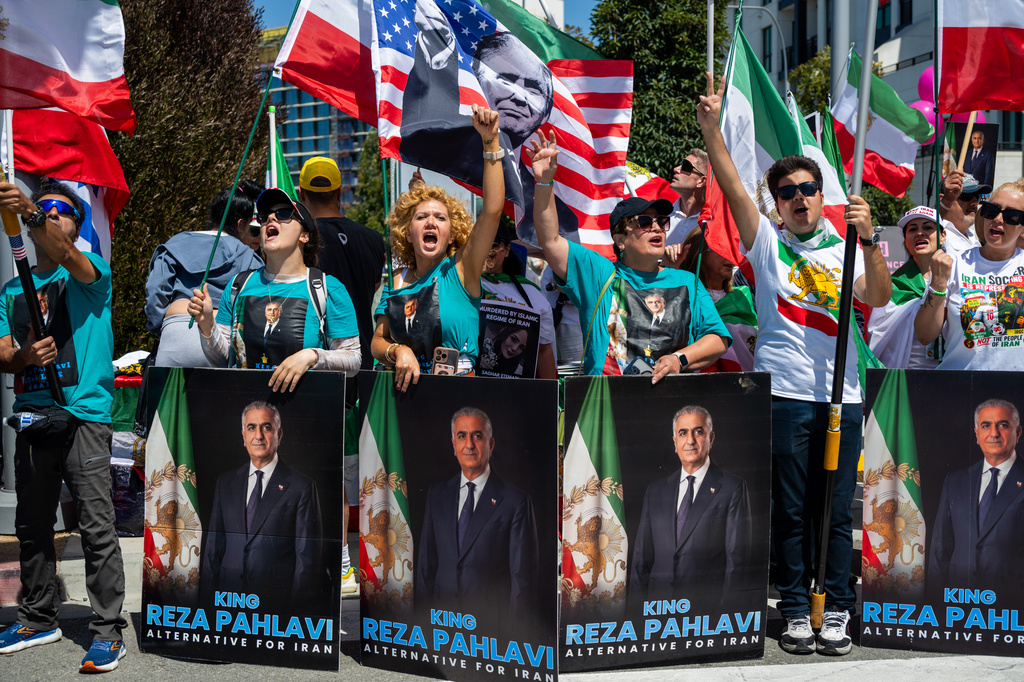 People chant and cheer during a protest in reaction to FIFA's ban of Iran's pre-revolutionary flag inside World Cup stadiums Sunday, June 7, 2026, in Inglewood, Calif. (AP Photo/Benjamin Hanson)