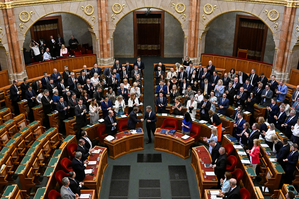 Deputies vote on the 17th amendment to the Fundamental Law at the plenary session of the parliament in in Budapest, Hungary, Monday, July 13, 2026. (Robert Hegedus/MTI via AP)