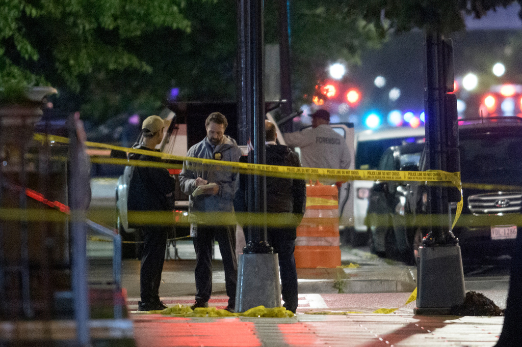 FILE - Law enforcement work the scene after two staff members of the Israeli Embassy in Washington were shot and killed outside the Capital Jewish Museum, May 22, 2025, in Washington. (AP Photo/Rod Lamkey, Jr., File)