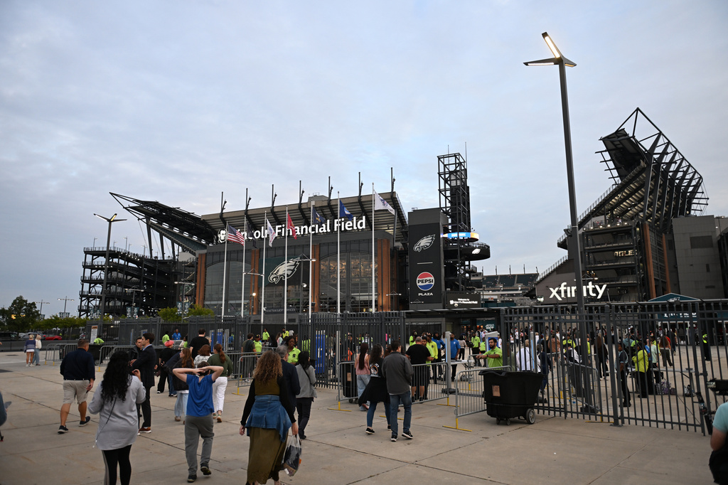 Concert goers arrive to Lincoln Financial Field before an Ed Sheeran concert in Philadelphia, Saturday, Sept. 19, 2026. (AP Photo/Allie Ippolito)