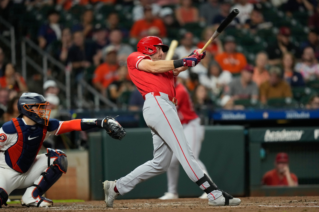 Los Angeles Angels' Josh Lowe, right, hits a home run as Houston Astros catcher Yainer Diaz reaches for the pitch during the fourth inning of a baseball game Tuesday, Aug. 18, 2026, in Houston. (AP Photo/David J. Phillip)