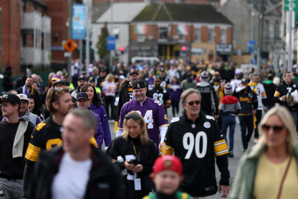Fans arrive before the start of the NFL football game between Minnesota Vikings and Pittsburgh Steelers at Croke Park stadium in Dublin, Sunday, Sept. 28, 2025.(AP Photo/Ian Walton)
