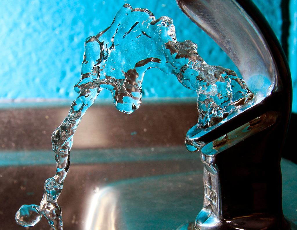 FILE - In this Jan. 7, 2011 file photo, water flows from a water fountain in Concord, N.H. (AP Photo/Jim Cole, File)