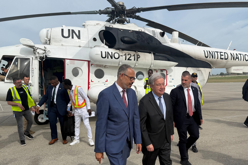 Haitian Prime Minister Alix Didier Fils-Aimé, front center, walks with U.N. Secretary-General Antonio Guterres as Guterres arrives to Port-au-Prince, Haiti, Tuesday, June 16, 2026. (AP Photo/Danica Coto)