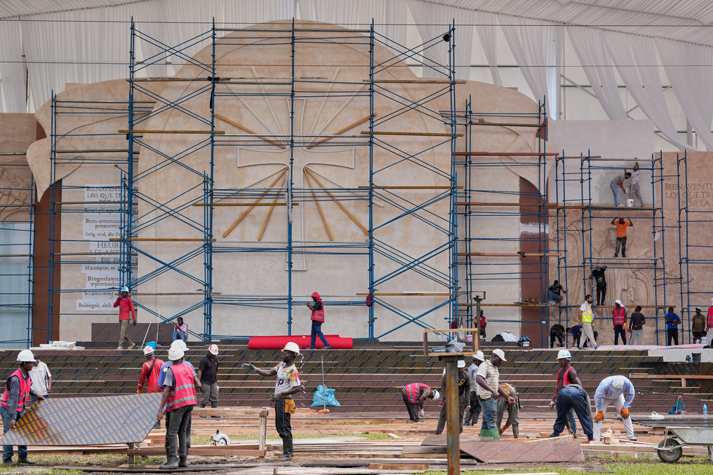 Workers carry out work at the Malabo Stadium ahead of Pope Leo XIV's visit in Malabo, Equatorial Guinea, Saturday, April 18, 2026. (AP Photo/Misper Apawu)