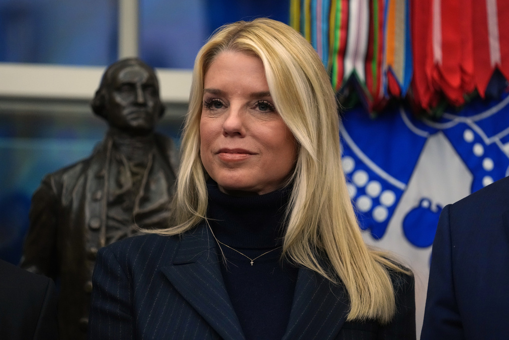 Attorney General Pam Bondi listens as President Donald Trump speaks at an event on addiction recovery in the Oval Office of the White House, Thursday, Jan. 29, 2026, in Washington. (AP Photo/Allison Robbert)