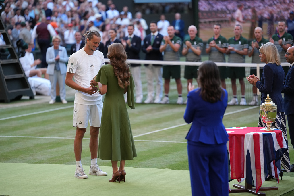 Britain's Princess Kate presents the runner-up trophy to Alexander Zverev of Germany after his match against Jannik Sinner of Italy in the men's singles final at Wimbledon Tennis Championships in London, Sunday, July 12, 2026. (AP Photo/Kirsty Wigglesworth)