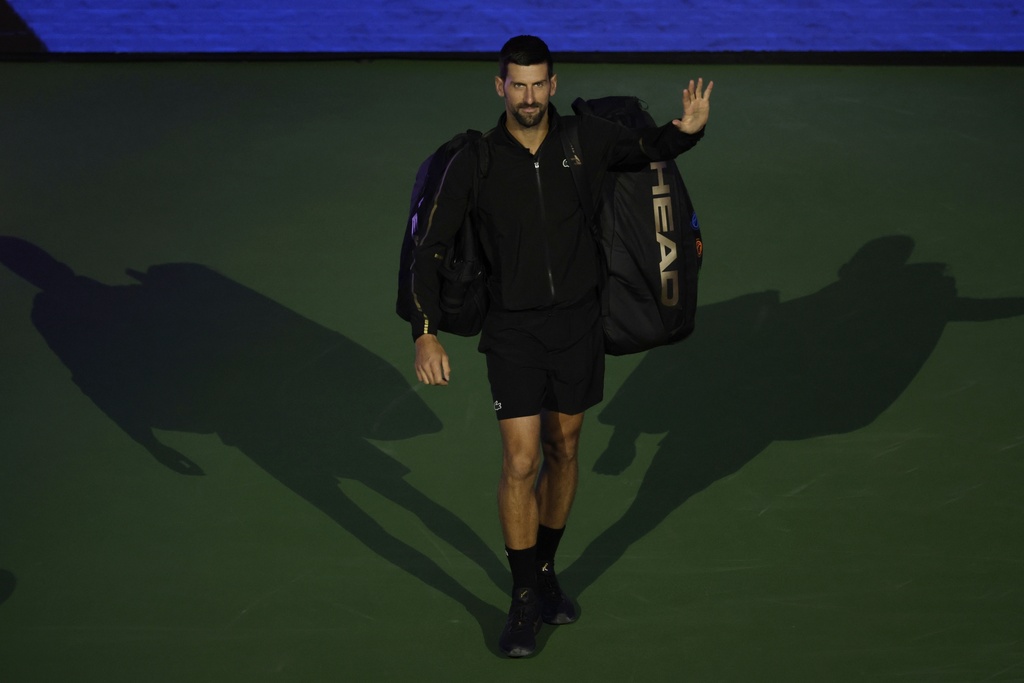 Novak Djokovic, of Serbia, is introduced before a the quarterfinal round match against Taylor Fritz, of the United States, of the U.S. Open tennis championships, Tuesday, Sept. 2, 2025, in New York. (AP Photo/Adam Hunger)