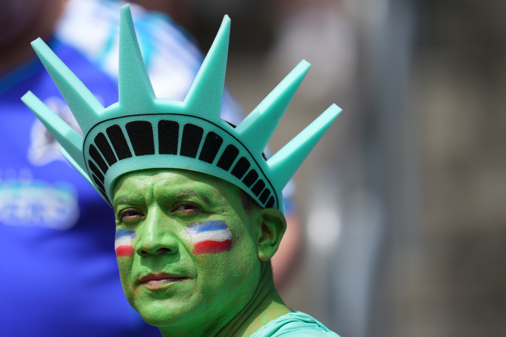 A fan waits for the start of the World Cup Group D soccer match between the United States and Australia in Seattle, Friday, June 19, 2026. (AP Photo/Manu Fernandez)