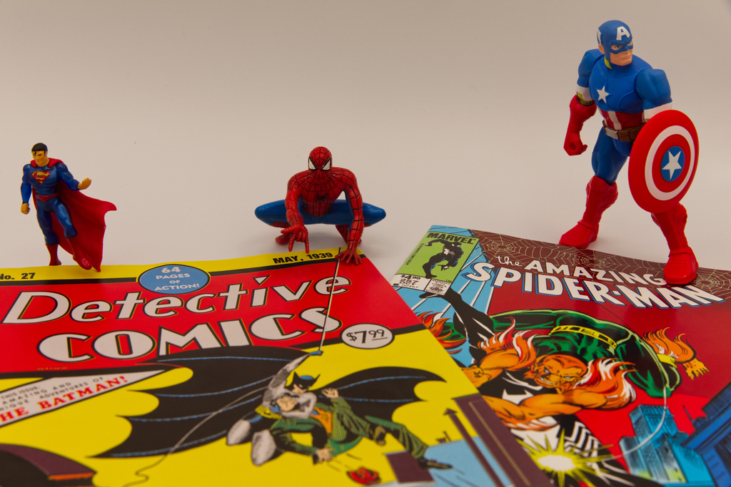 Famous comic book superhero figurines stand next to facsimile copies of comic book issues in Phoenix, May 14, 2026. (AP Photo/Dario Lopez-Mills)