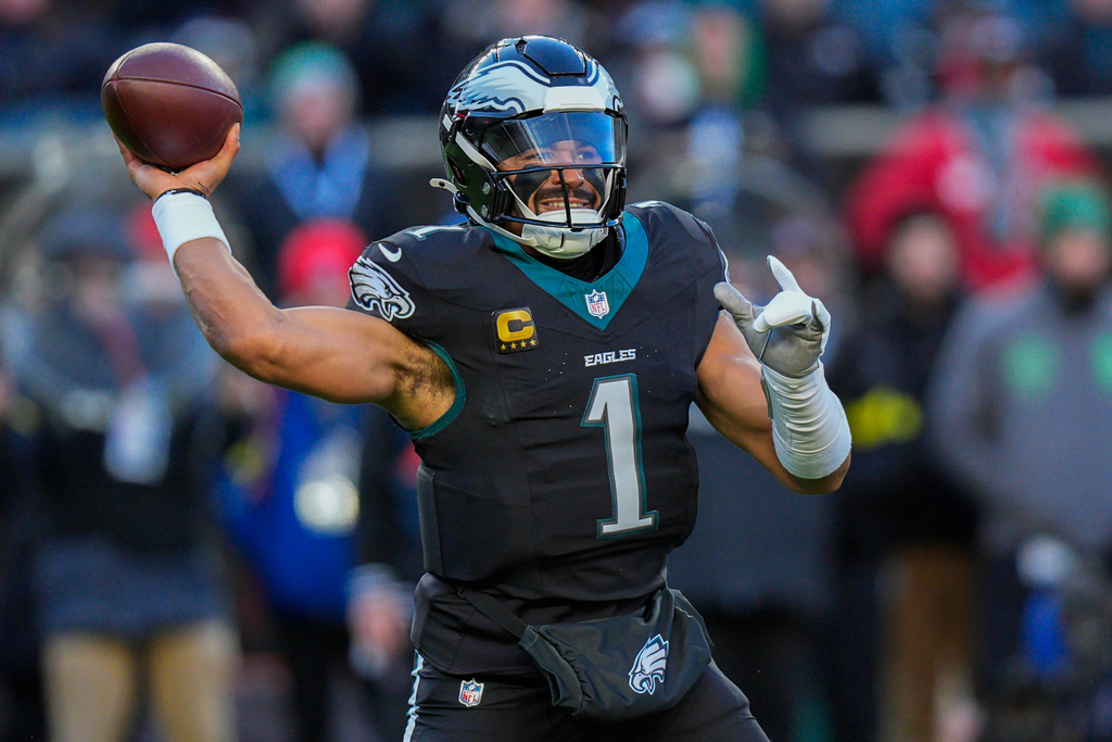 Philadelphia Eagles quarterback Jalen Hurts (1) passes during the first half of an NFL football game against the Chicago Bears, Friday, Nov. 28, 2025, in Philadelphia. (AP Photo/Chris Szagola)