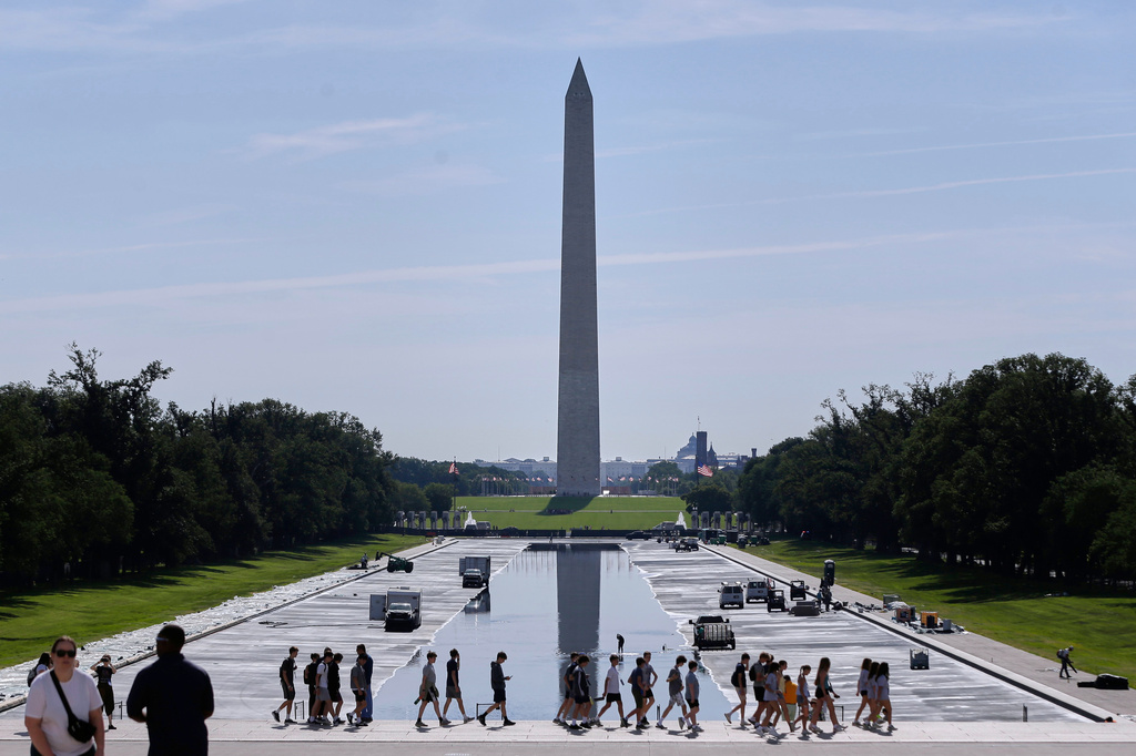 The Lincoln Memorial Reflecting Pool is being refilled after several months of repairs on Friday, June 5, 2026, in Washington, with the Washington Monument in the background. (AP Photo/Rahmat Gul)