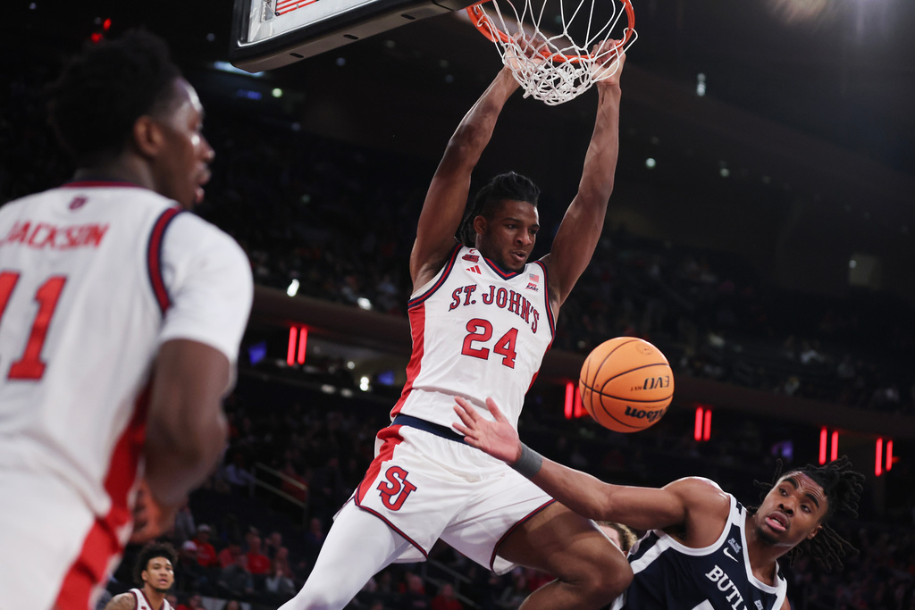 St. John's forward Zuby Ejiofor (24) dunks the ball past Butler forward Michael Ajayi (5) during the second half of an NCAA college basketball game, Wednesday, Jan. 28, 2026, in New York. (AP Photo/Heather Khalifa)