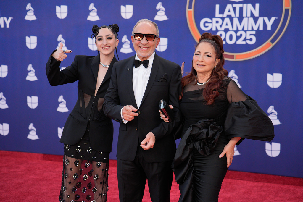 Emily Estefan, from left, Emilio Estefan, and Gloria Estefan arrive at the 2025 Latin Grammys on Thursday, Nov. 13, 2025, at MGM Grand in Las Vegas. (AP Photo/John Locher)