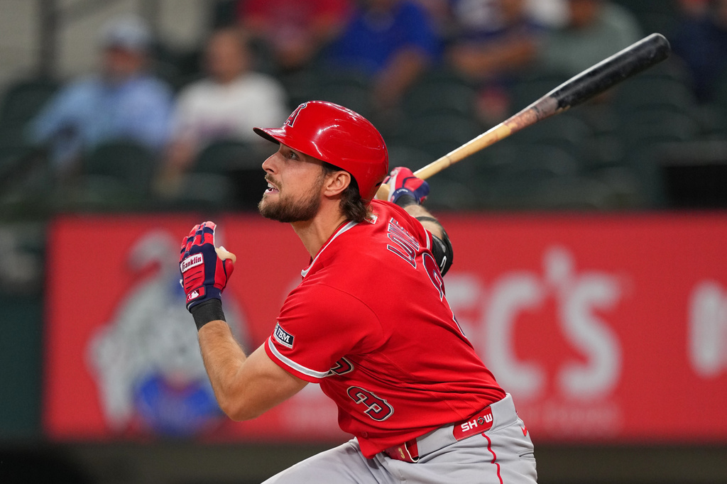 Los Angeles Angels' Josh Lowe watches his ball as he hits an RBI single to score Jorge Soler against the Texas Rangers during the first inning of a baseball game, Tuesday, July 7, 2026, in Arlington, Texas. (AP Photo/Julio Cortez)
