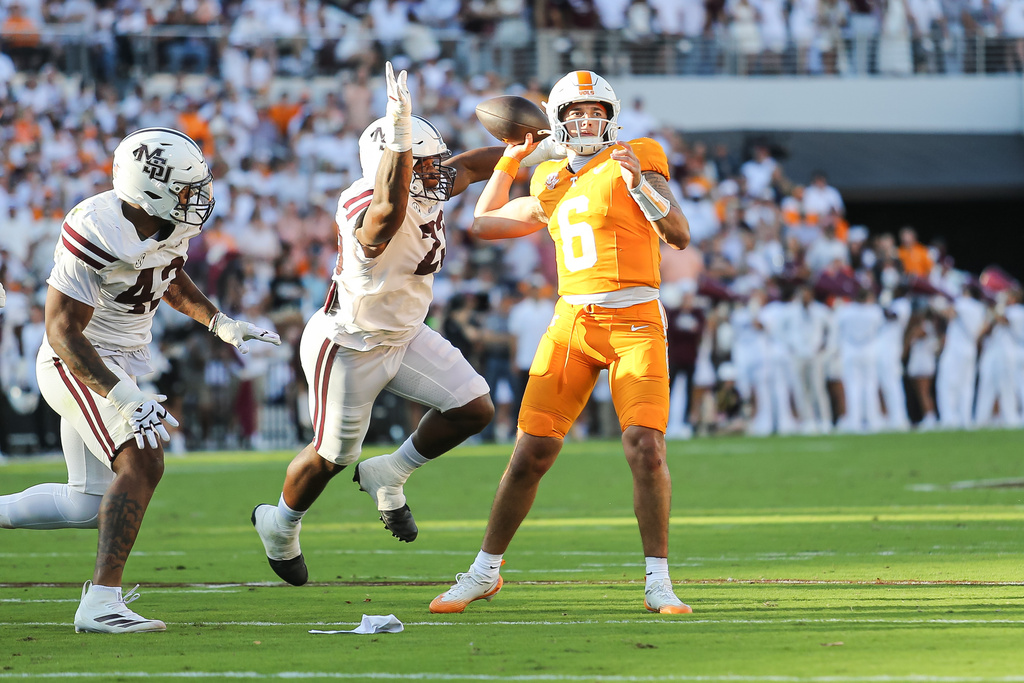 Tennessee quarterback Joey Aguilar (6) is pressured by Mississippi State defensive lineman Trevion Williams (23) during the second half of an NCAA college football game in Starkville, Miss., Saturday, Sept. 27, 2025. (AP Photo/James Pugh)