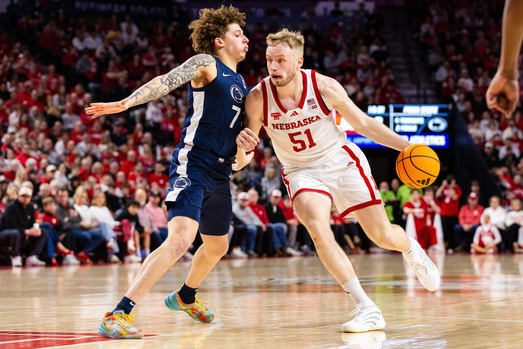 Nebraska forward Rienk Mast (51) drives against Penn State guard Dominick Stewart (7) during the first half of an NCAA college basketball game, Saturday, Feb. 21, 2026, in Lincoln, Neb. (AP Photo/Bonnie Ryan)