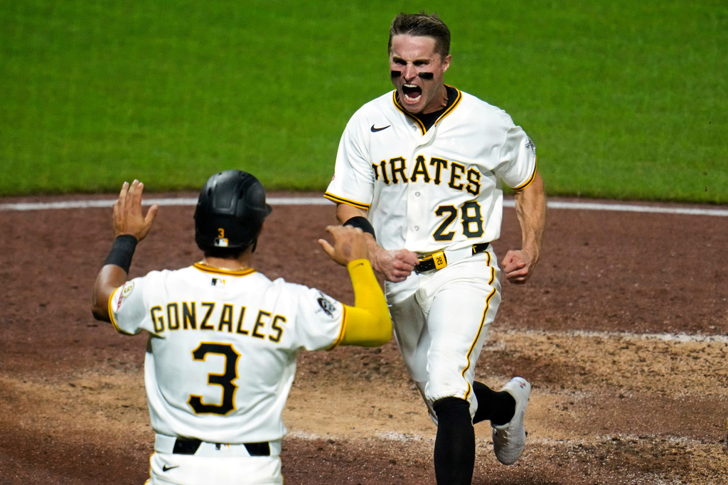 Pittsburgh Pirates' Jake Mangum (28) scores the third of three runs on a bases loaded double by Nick Yorke off Detroit Tigers pitcher Framber Valdez during the sixth inning of a baseball game in Pittsburgh, Monday, Aug. 17, 2026. (AP Photo/Gene J. Puskar)