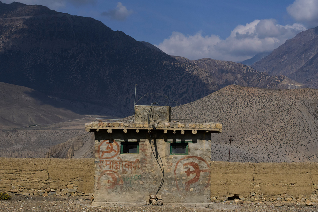 Communist graffiti is seen on the wall of a small building along a highway in Mustang district, Nepal, April 17, 2025. (AP Photo/Niranjan Shrestha)
