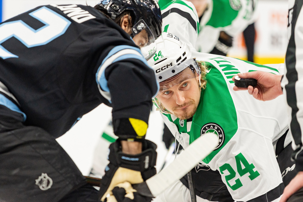 Dallas Stars center Roope Hintz (24) faces off against Utah Mammoth center Kevin Stenlund, left, during the second period of an NHL hockey game Saturday, Jan. 31, 2026, in Salt Lake City. (AP Photo/Melissa Majchrzak)