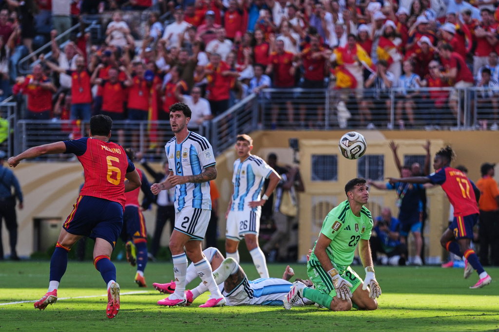 Argentina goalkeeper Emiliano Martinez (23), Marcos Senesi (2) and Nahuel Molina (26) react after Spain's Ferran Torres (7) scores their first goal during the World Cup final soccer match between Spain and Argentina in East Rutherford, N.J., near New York, Sunday, July 19, 2026. (AP Photo/Abbie Parr)
