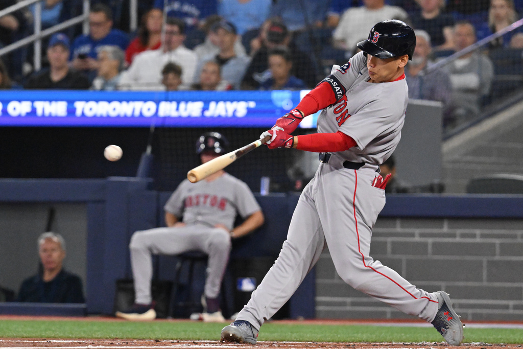 Boston Red Sox's Masataka Yoshida (7) hits a double against the Toronto Blue Jays in second inning American League baseball action in Toronto on Tuesday, Sept. 23, 2025. (Jon Blacker/The Canadian Press via AP)