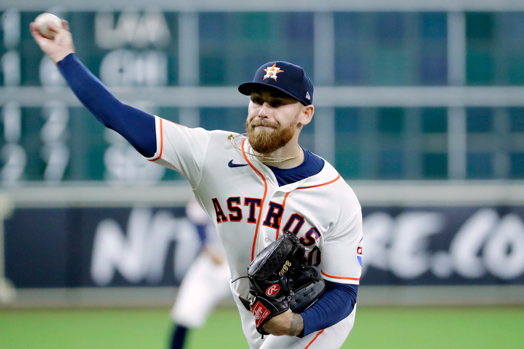 Houston Astros starting pitcher Mike Burrows throws against the Boston Red Sox during the first inning of a baseball game Wednesday, April 1, 2026, in Houston. (AP Photo/Michael Wyke)