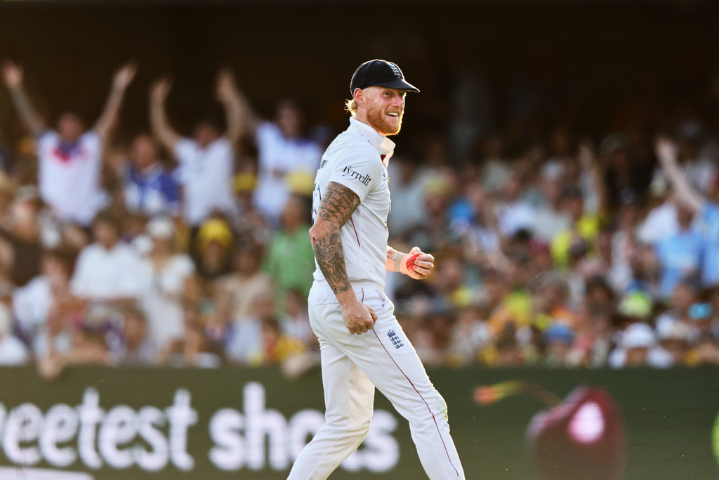 England's captain Ben Stokes celebrates the wicket of Australia's Mitchell Starc during the second Ashes cricket test match between Australia and England in Brisbane, Saturday, Dec. 6, 2025.. (AP Photo/Tertius Pickard)