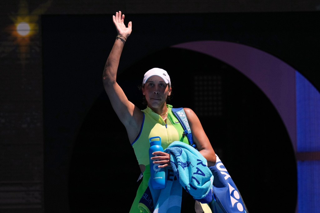 Madison Keys of the U.S. waves at the crowd following her loss to her compatriot Jessica Pegula in their fourth round match at the Australian Open tennis championship in Melbourne, Australia, Monday, Jan. 26, 2026. (AP Photo/Mark Baker)
