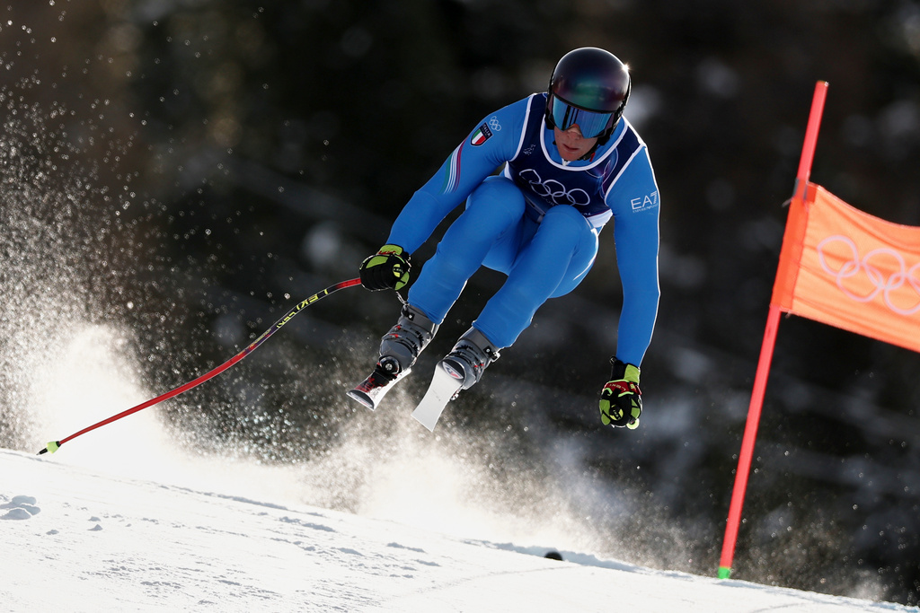 Italy's Giovanni Franzoni speeds down the course during an alpine ski, men's downhill official training, at the 2026 Winter Olympics, in Bormio, Italy, Thursday, Feb. 5, 2026. (AP Photo/Gabriele Facciotti)