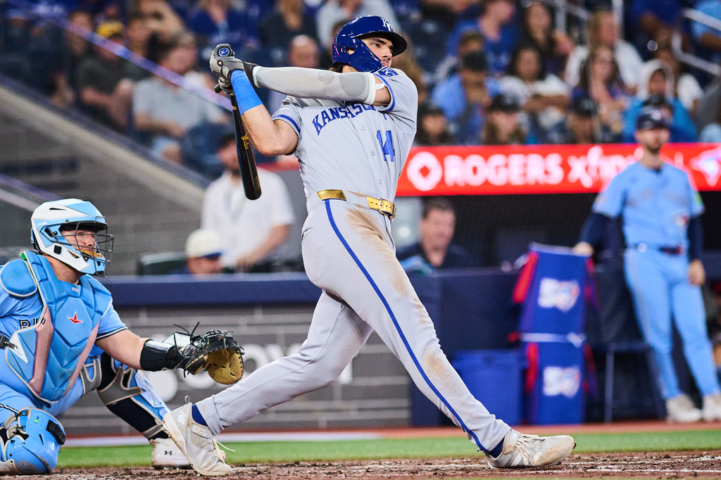 Kansas City Royals' Jac Caglianone (14) hits a two-run single against the Toronto Blue Jays during the sixth inning of a baseball game in Toronto, Thursday, Aug. 27, 2026. (Sammy Kogan/The Canadian Press via AP)