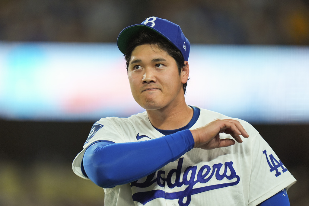 Los Angeles Dodgers starting pitcher Shohei Ohtani walks toward the dugout after the fourth inning of a baseball game against the New York Mets Wednesday, April 15, 2026, in Los Angeles. (AP Photo/Jae C. Hong)