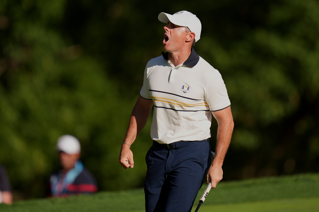 Europe's Rory McIlroy celebrates after a putt on the 15th hole during their singles match on the Bethpage Black golf course at the Ryder Cup golf tournament, Sunday, Sept. 28, 2025, in Farmingdale, N.Y. (AP Photo/Seth Wenig)