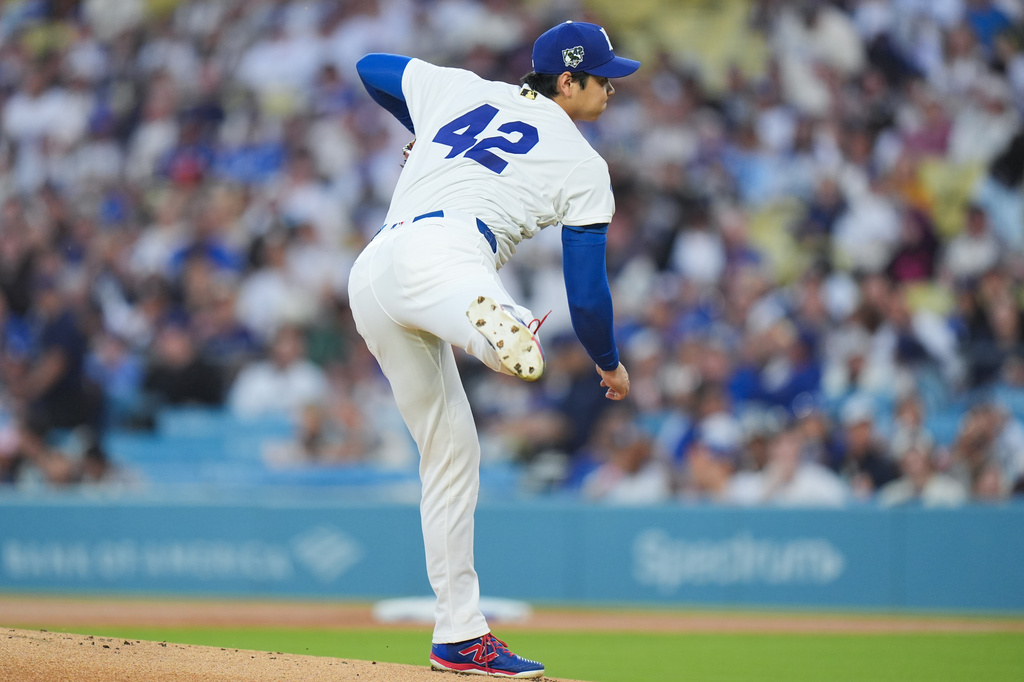 Los Angeles Dodgers starting pitcher Shohei Ohtani follows through on his pitch against the New York Mets during the first inning of a baseball game Wednesday, April 15, 2026, in Los Angeles. (AP Photo/Jae C. Hong)