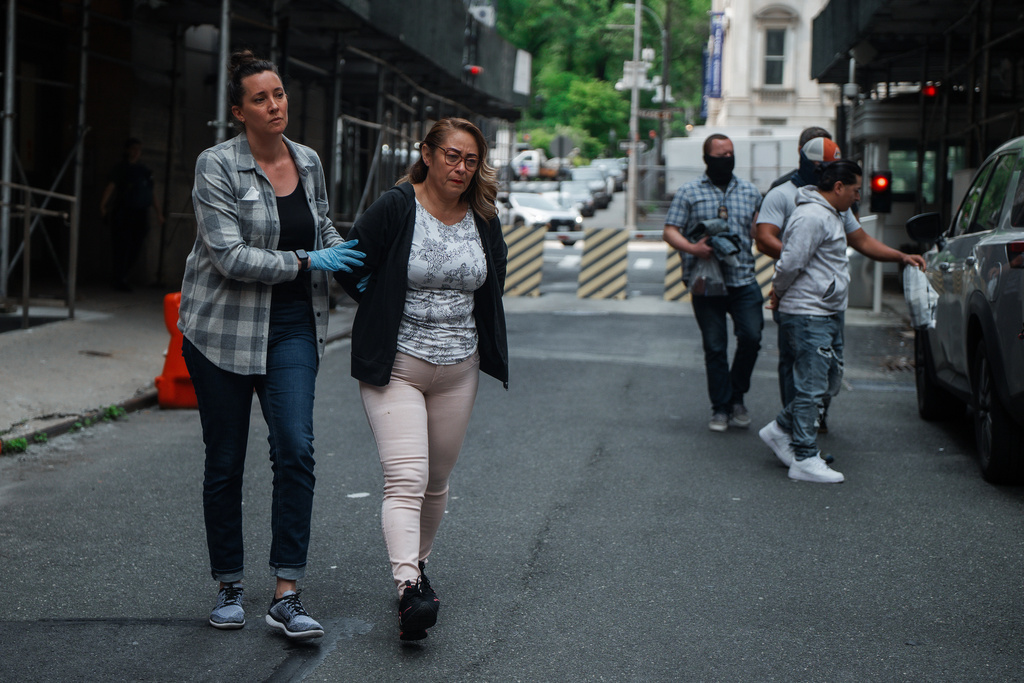 Federal agents escort handcuffed detainees after arresting them during a regular check-in with U.S. Immigration and Customs Enforcement, Wednesday, June 4, 2025, in New York. (AP Photo/Olga Fedorova)