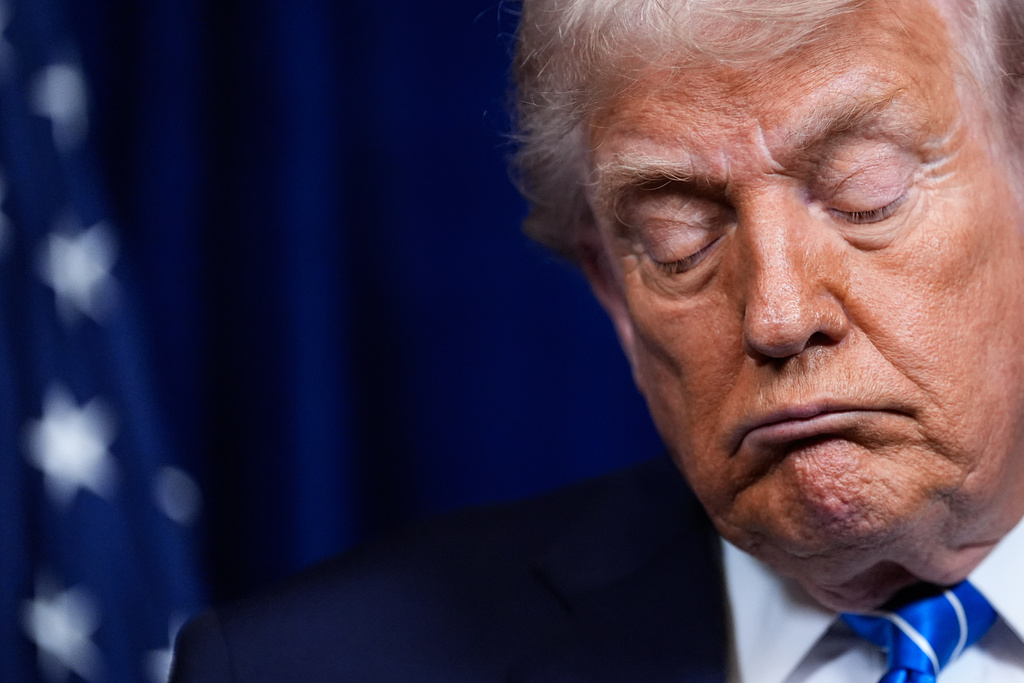 President Donald Trump closes his eyes during a joint news conference with Ukraine's President Volodymyr Zelenskyy following a meeting at his Mar-a-Lago club, Sunday, Dec. 28, 2025, in Palm Beach, Fla. (AP Photo/Alex Brandon)