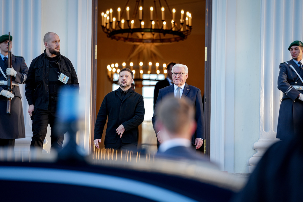 German President Frank-Walter Steinmeier, center right, and Volodymyr Zelenskyy, center left, President of Ukraine, leave the Bellevue Palace in Berlin, Germany, Monday, Dec. 15, 2025. (Kay Nietfeld/dpa/dpa via AP)