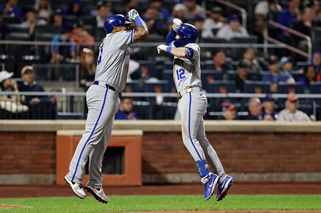 Kansas City Royals' Nick Loftin (12) celebrates his two-run home run with Salvador Perez during the seventh inning of a baseball game against the New York Mets, Tuesday, July 7, 2026, in New York. (AP Photo/Adam Hunger)