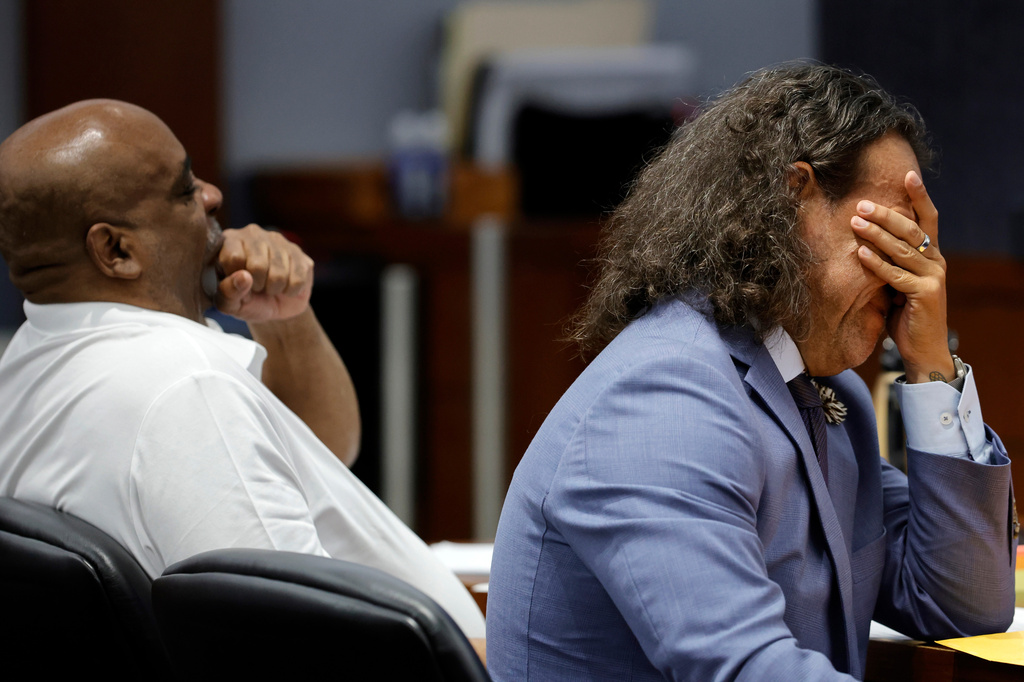 Michael Sanft, right, attorney for Duane Davis, rubs his face while sitting with Davis, left, during the third day of jury selection in Davis' murder trial, related to the 1996 killing of rapper Tupac Shakur, at Clark County District Court Regional Justice Center on Wednesday, Aug. 12, 2026, in Las Vegas. (Steve Marcus/Las Vegas Sun via AP, Pool)